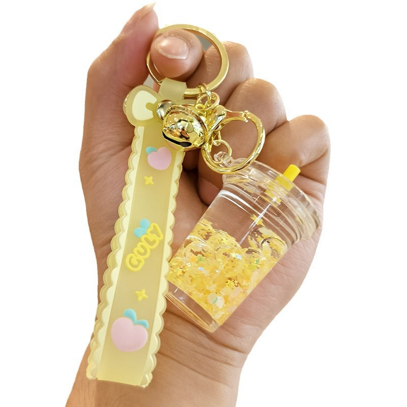 Wholesale quicksand luminous cup keychain liquid oil drift bottle pendant
