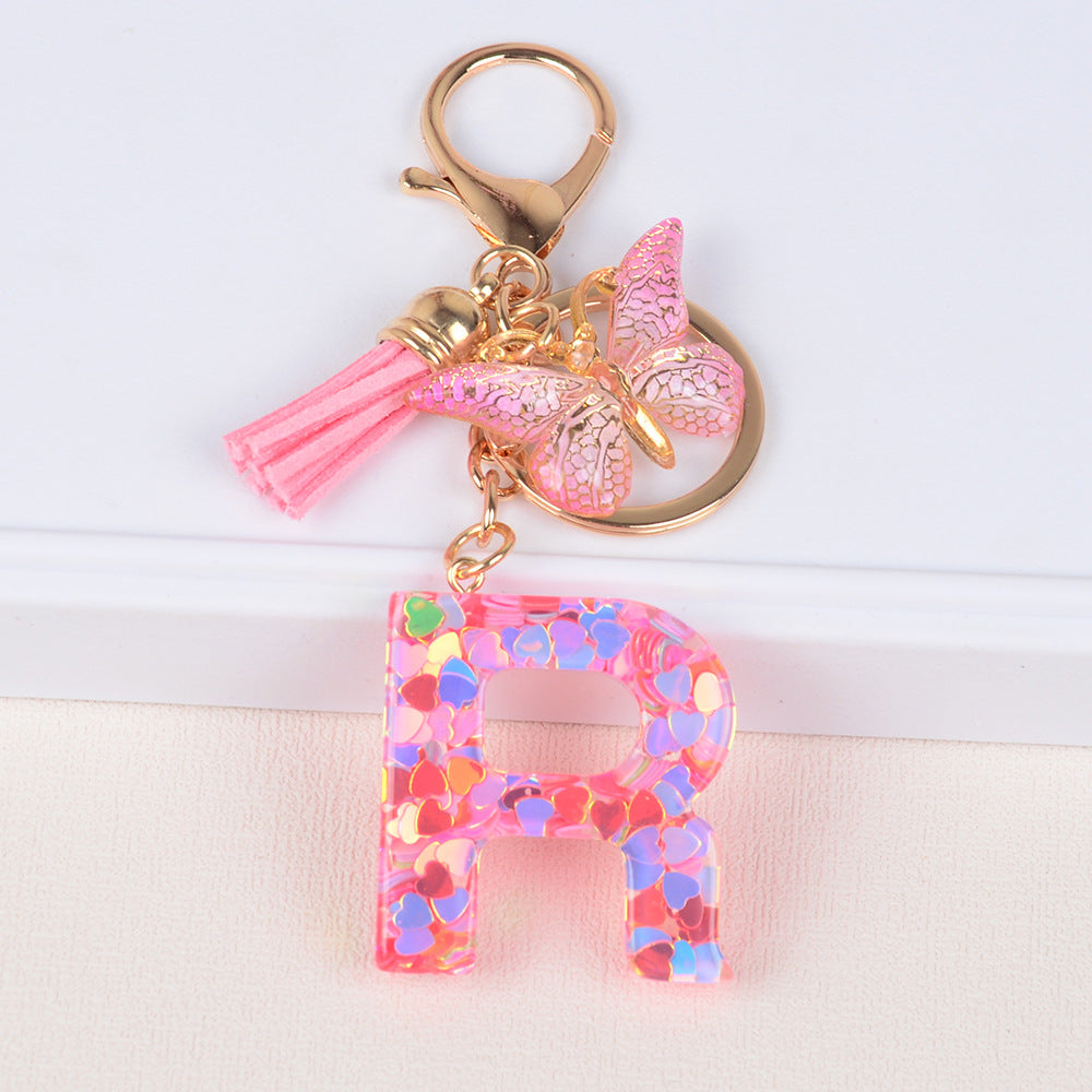 卸売ピンクタッセルバタフライグリッターレター樹脂キーホルダー