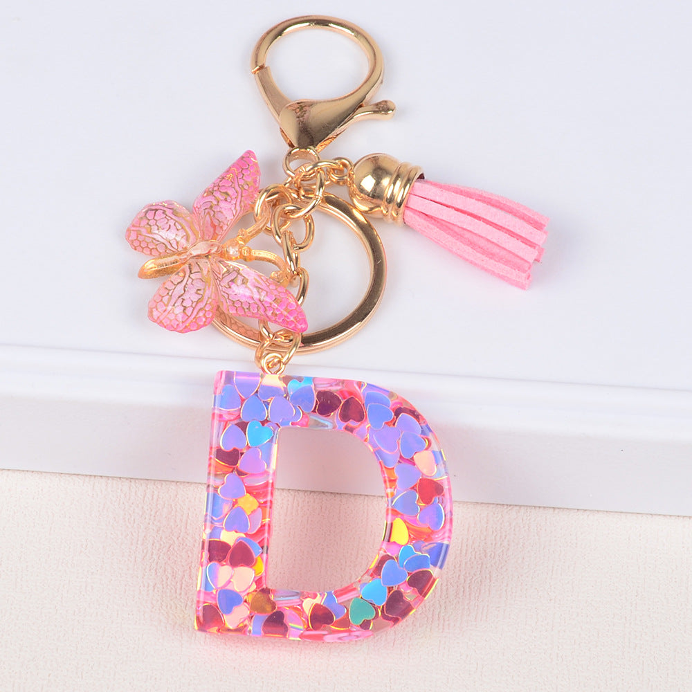 卸売ピンクタッセルバタフライグリッターレター樹脂キーホルダー