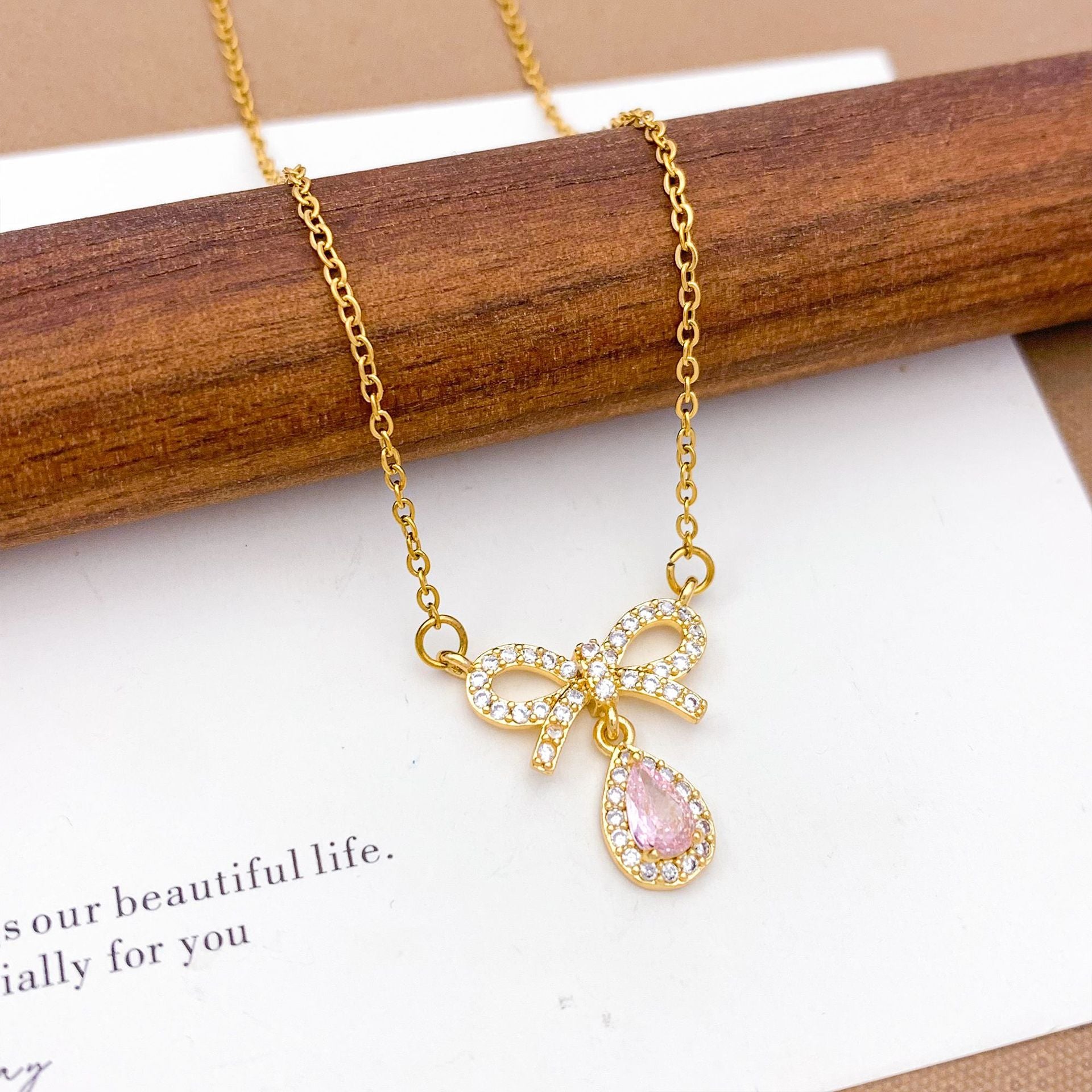 Wholesale Pink heart-shaped bow with diamond studded titanium steel necklace