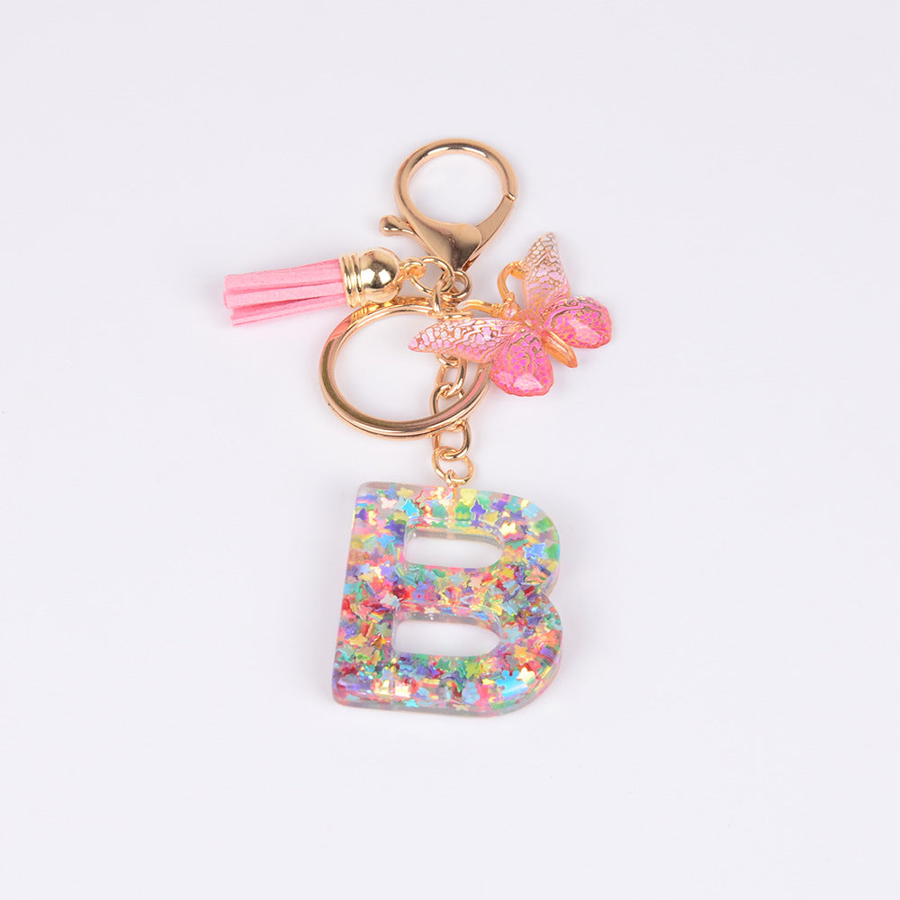 卸売スパンコール英語蝶タッセル文字樹脂キーホルダー