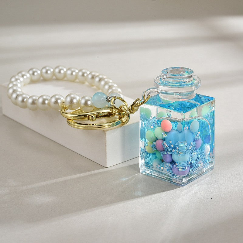 Wholesale Liquid sand bottle with colorful beads in oil bottle pendant acrylic keychain
