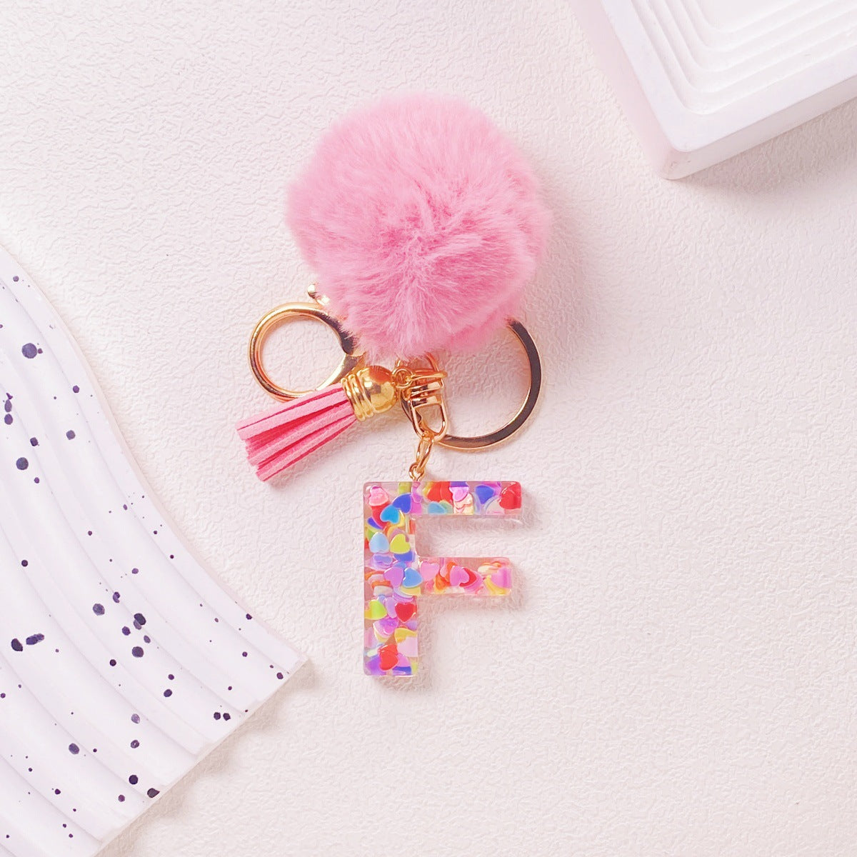 Wholesale Hairball English 26 letter pink Pom Pom keychain