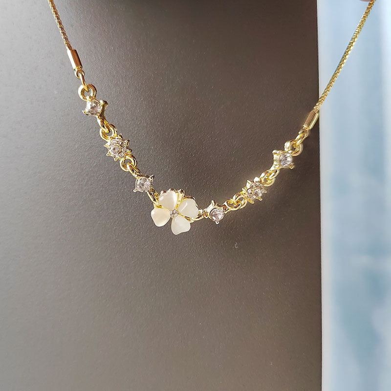 Wholesale Real gold electroplated diamond cat's eye stone high-end temperament petal flower hand jewelry