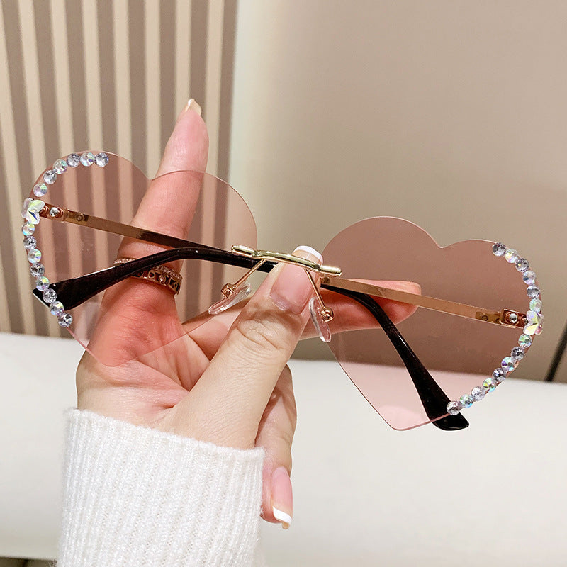 Wholesale Travel Driving Metal Heart Frameless Cut Edge Diamond Heart Sunglasses