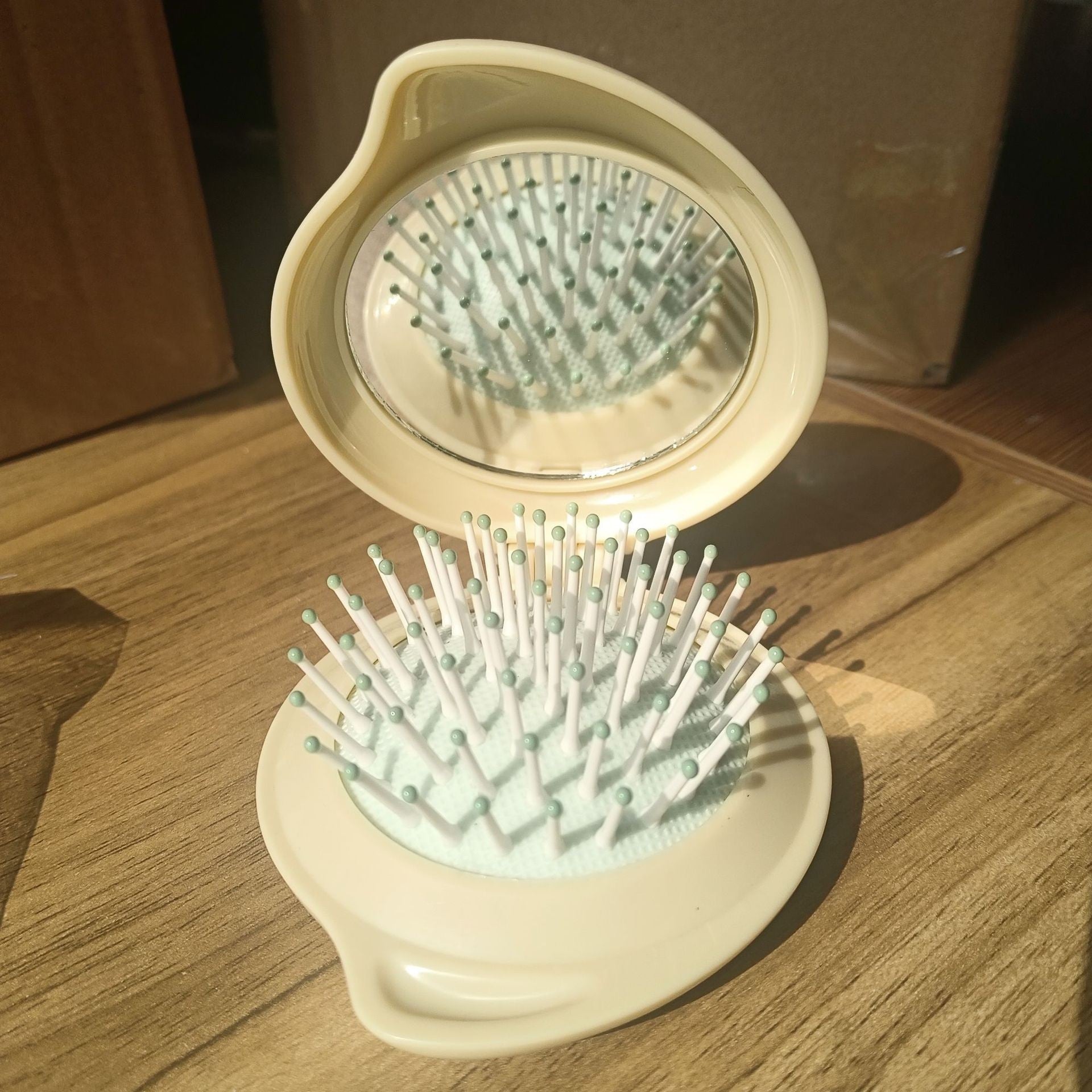 Wholesale ABS Droplet Shaped Cream Gel Folding Mirror Airbag Comb