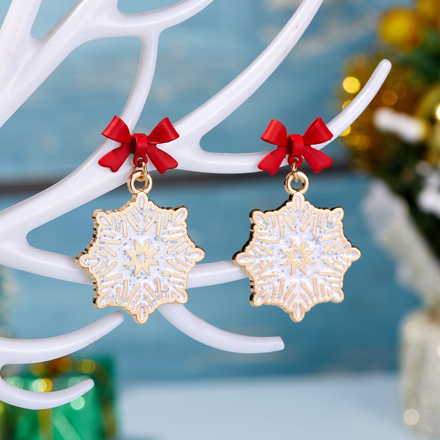 Wholesale Christmas Drip Oil Bow Knot Hollow Snowflake Alloy Earrings