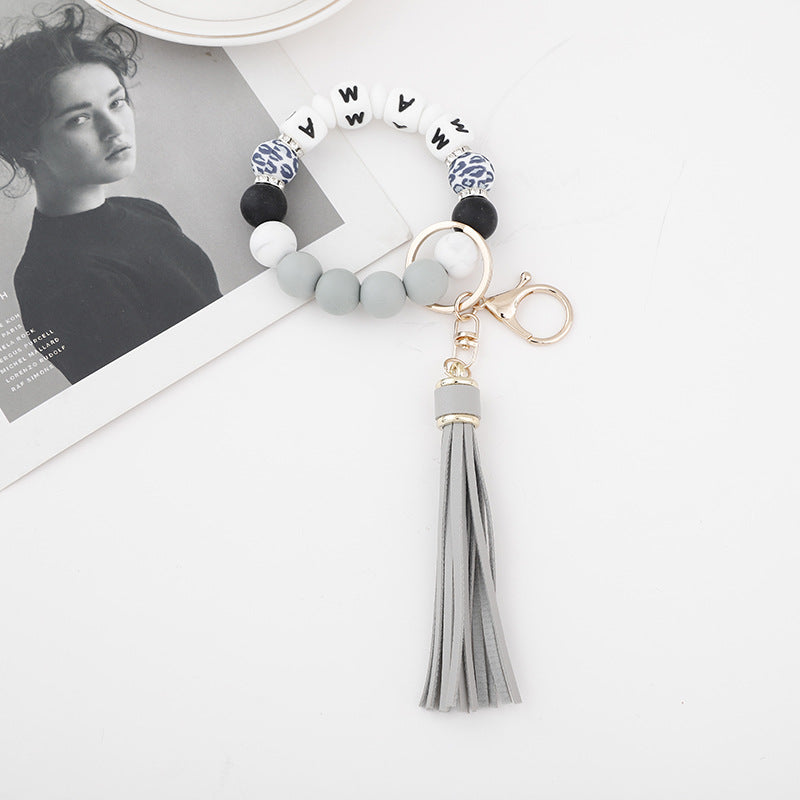 Wholesale 10PCS Silicone Bead Bracelets with Tassel Wood Beads Keychains