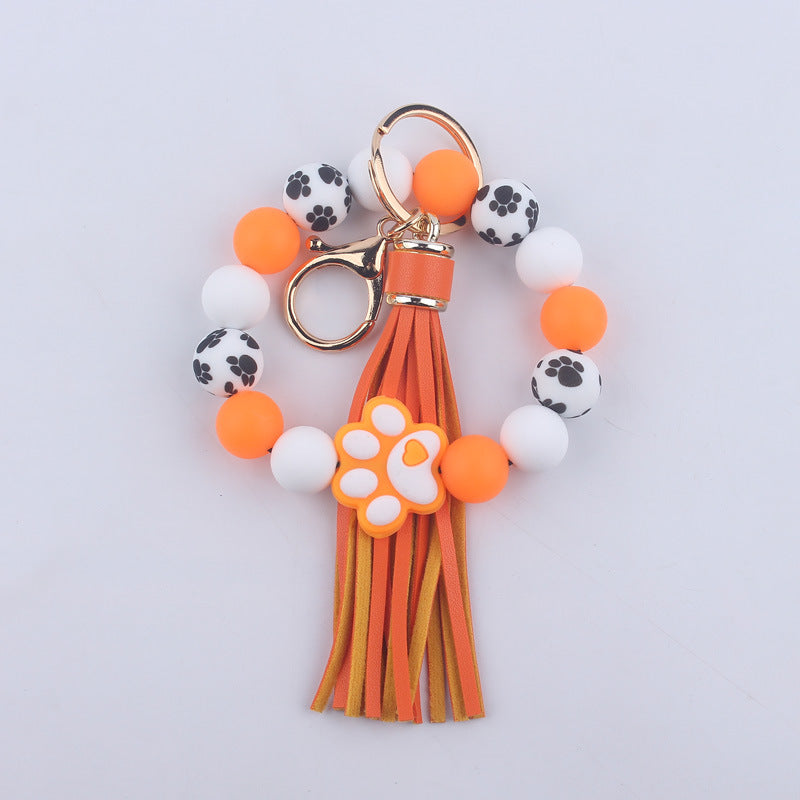Wholesale Chic Silicone Bead Dog Paw Bracelet Keychain With Leather Tassel Fashion Gift For Resale