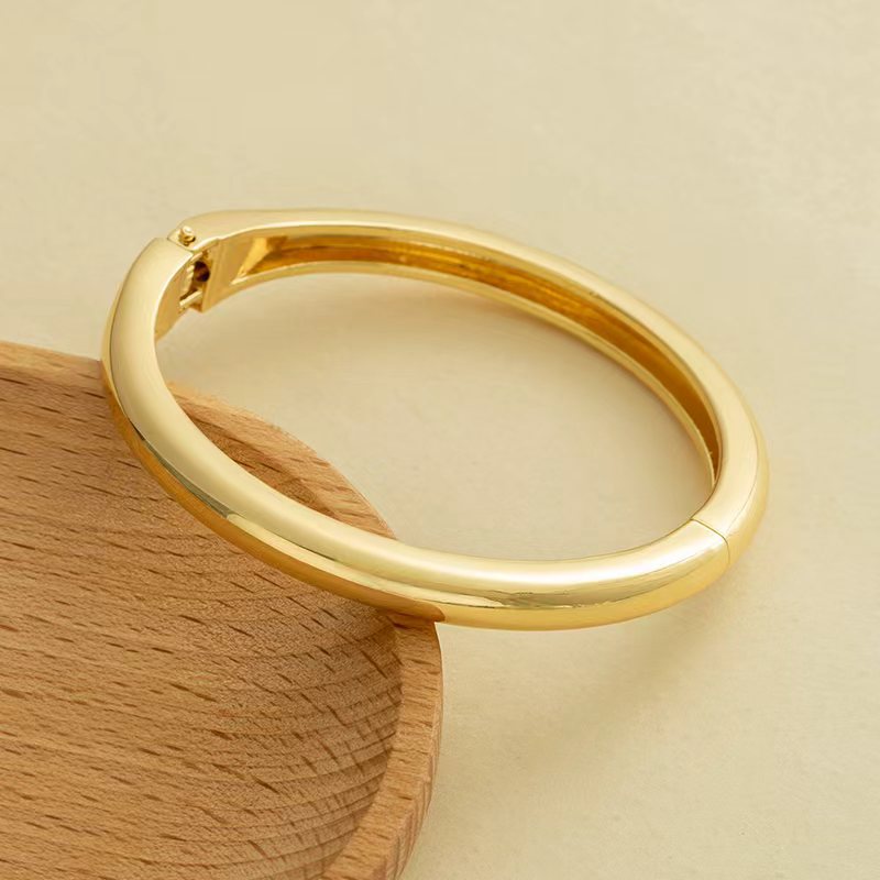 Wholesale Golden wide edged wave band exaggerated bracelet