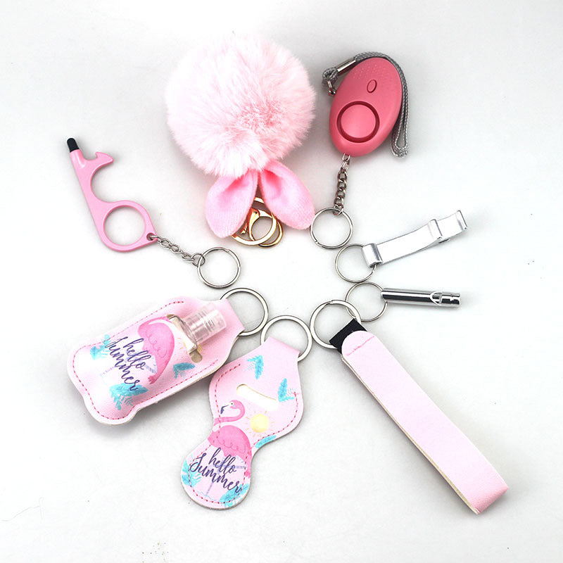 Wholesale Outdoor Whistle Hand Sanitizer Leather Case Fur Ball Key Chain Set