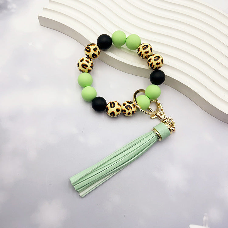 Wholesale Leopard Print Wood Beads Silicone Beaded Bracelet Tassel Key Ring