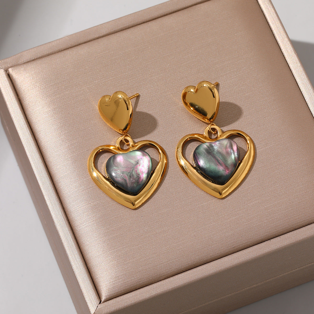 Wholesale Stainless steel heart earrings for women inlaid with cat' s eye stone