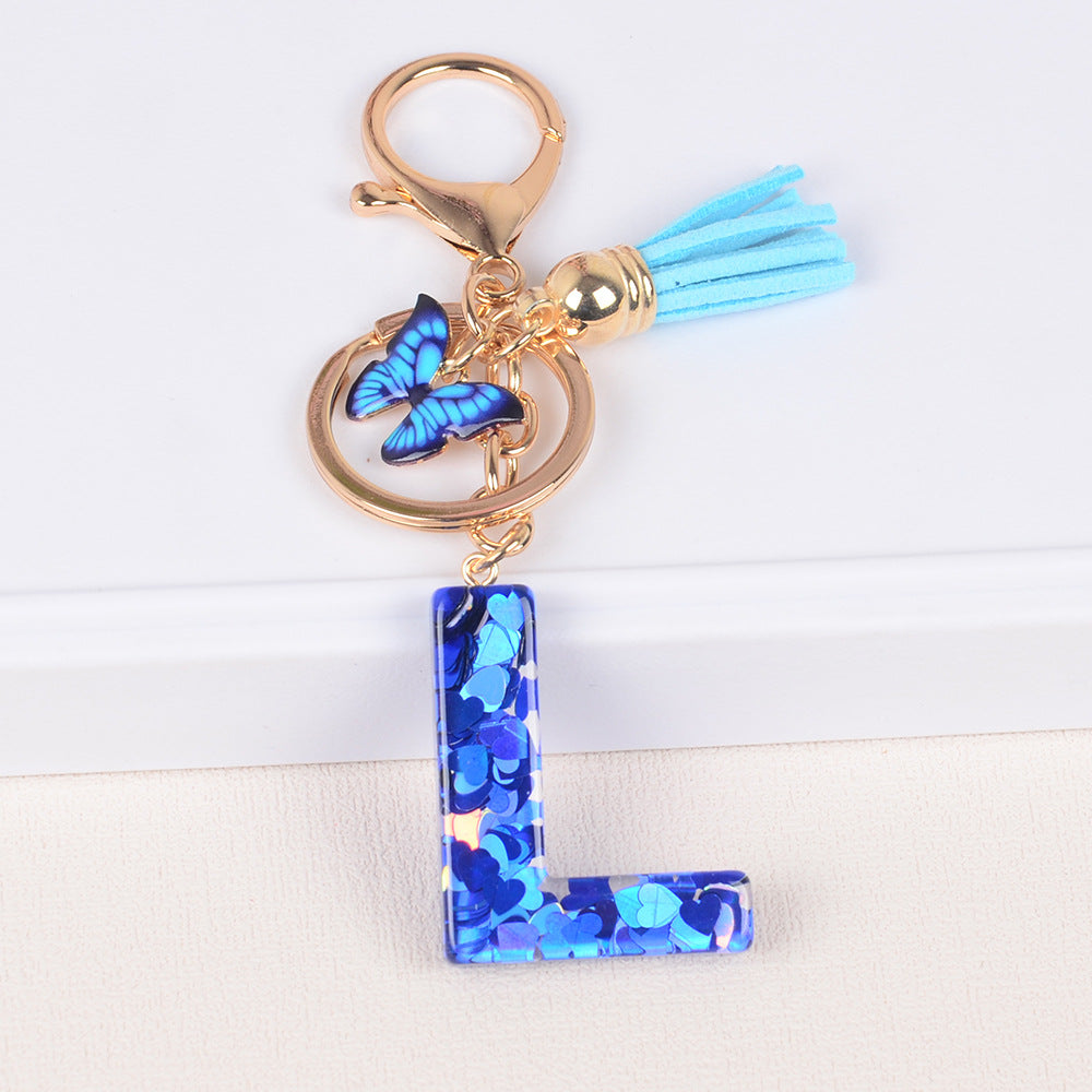 卸売ブルーラブバタフライタッセルレター樹脂キーホルダー