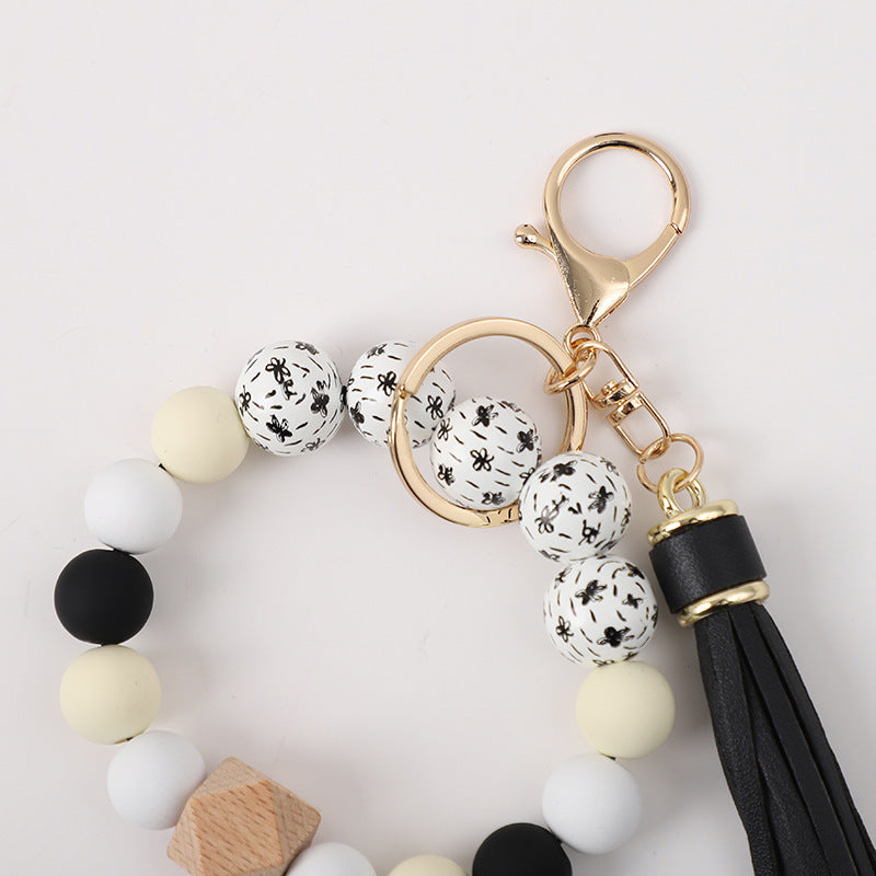 Llavero de muñeca de silicona de borla al por mayor