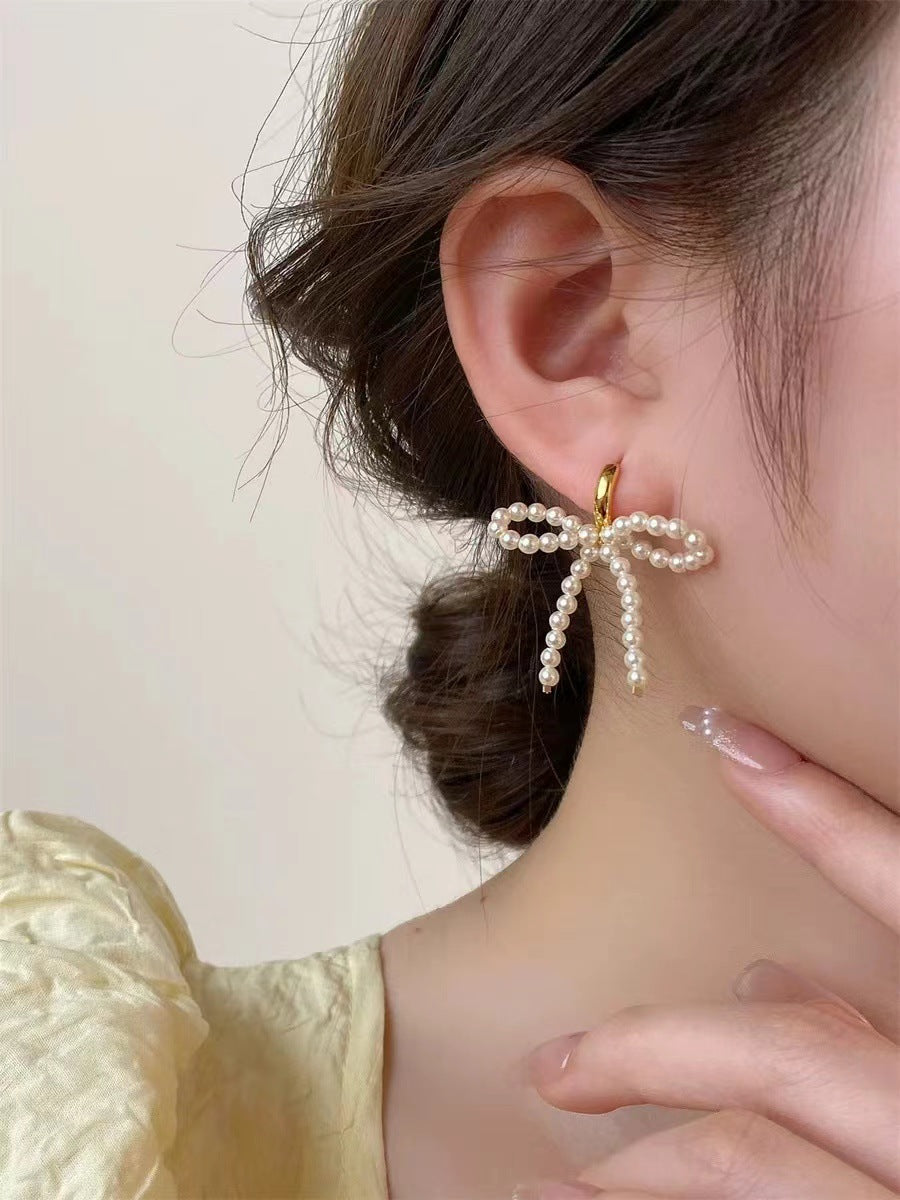 Wholesale Lady-style bow pearl earrings