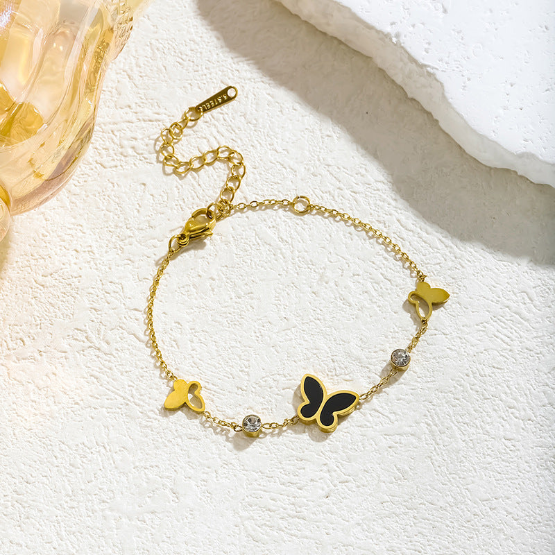 Wholesale Hollow out Fritillaria butterfly diamond titanium steel bracelet