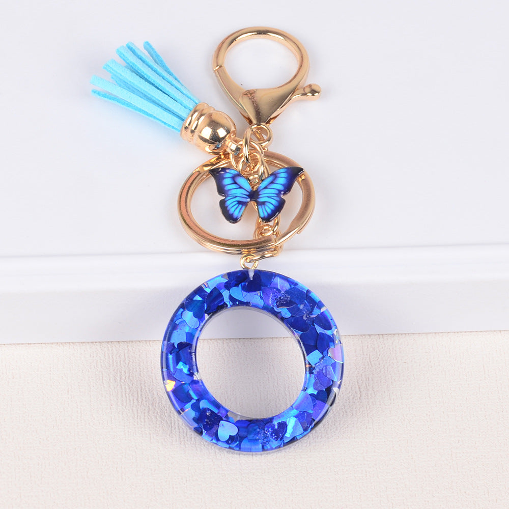 卸売ブルーラブバタフライタッセルレター樹脂キーホルダー