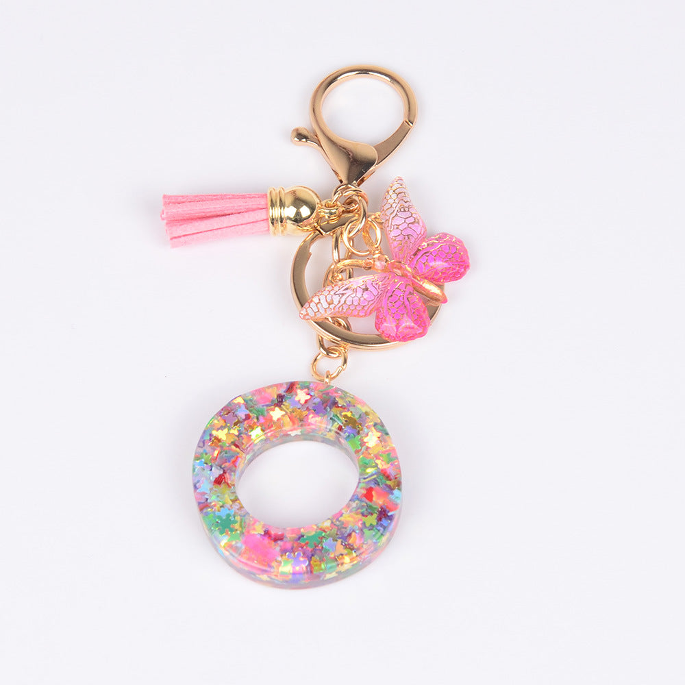 卸売スパンコール英語蝶タッセル文字樹脂キーホルダー