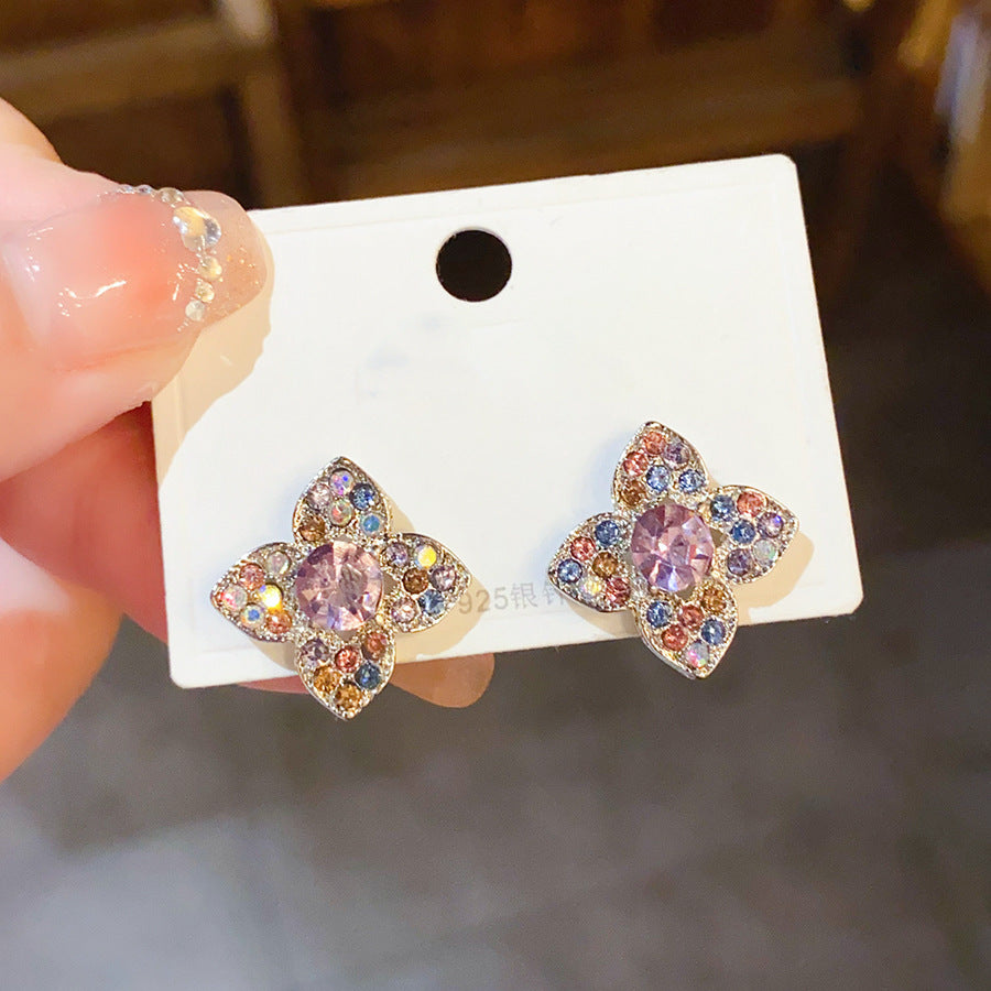 Wholesale Diamond studded bow with heart-shaped four leaf petal earrings