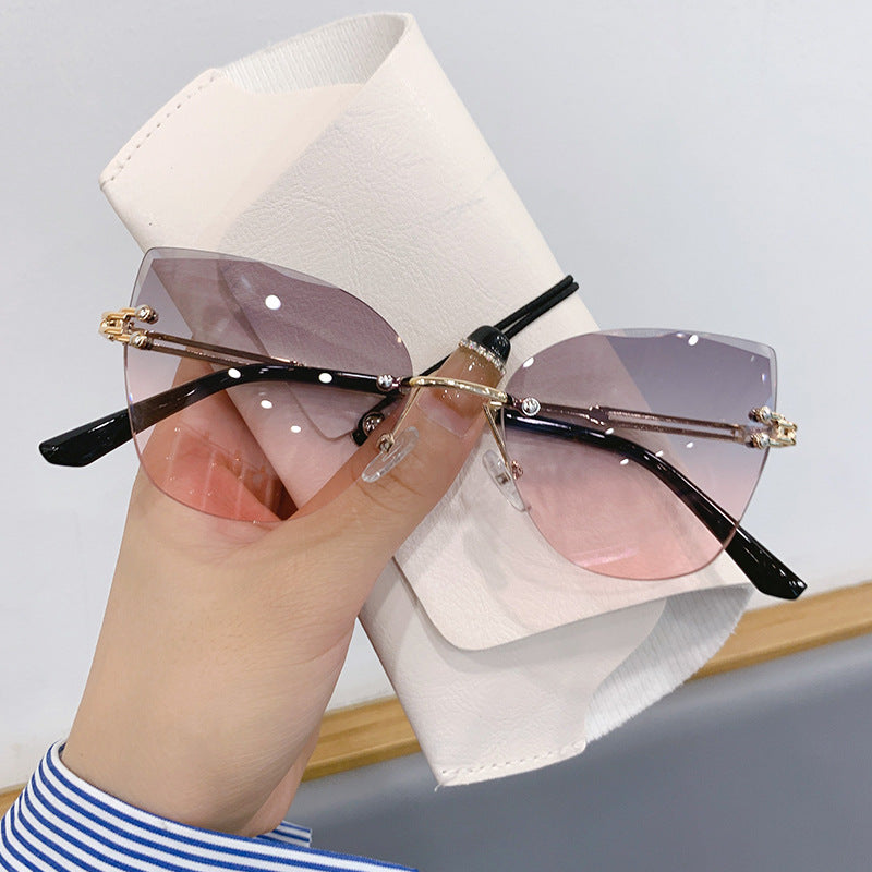Wholesale Retro frameless cut-edge sunglasses cat-eye gradient sunglasses