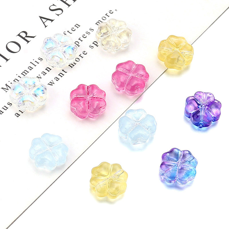 Al por mayor de 50 piezas/paquete de vidrio de color transparente de color trébol de cuatro hojas