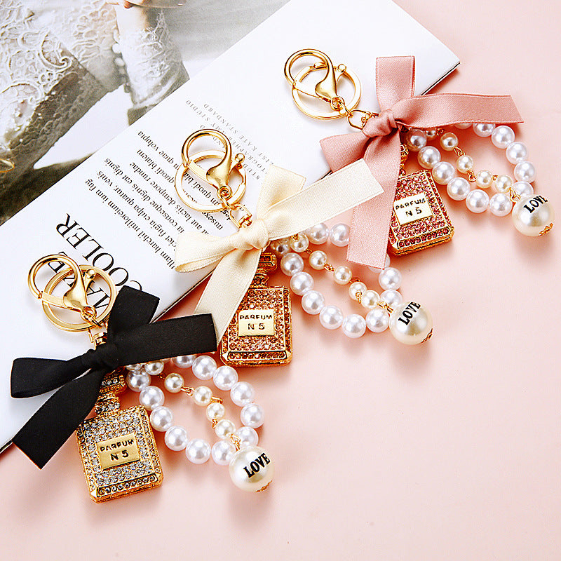 Wholesale Pearl Perfume Bottle Bow Rhinestone Keychain Bag Charm Chic Fashion Accessory Boutique Gift