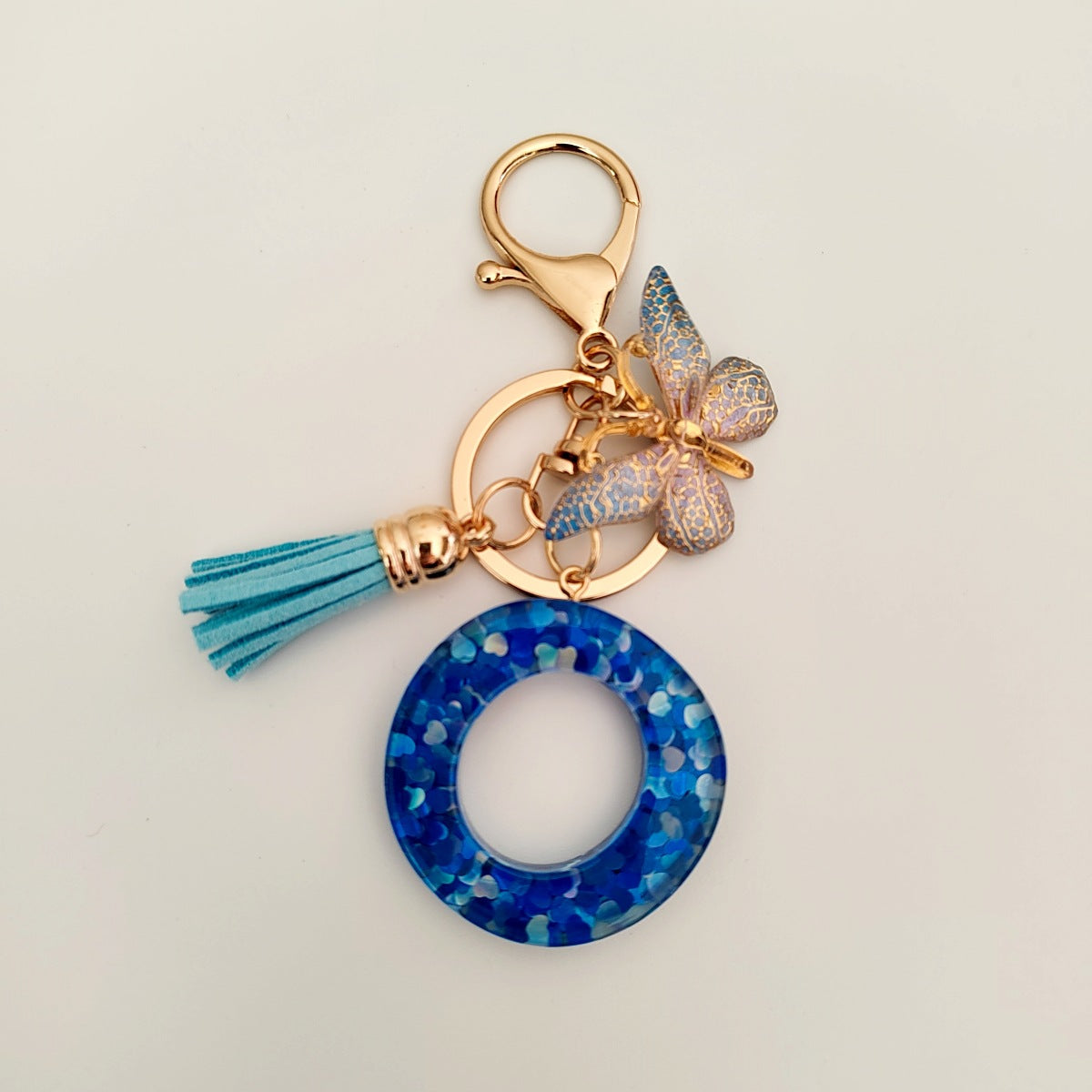 Wholesale blue crystal epoxy letter key chain pendant resin sequined butterfly key chain