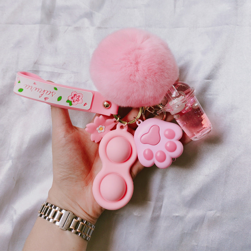 Silicona de silicona al por mayor Liquid Glow Cat Claw Fur Ball Keychain