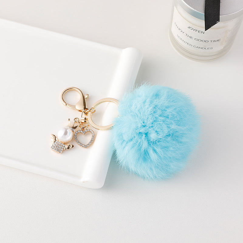 Wholesale of Cute Diamond Inlaid Angel Fur Ball Metal Keychains