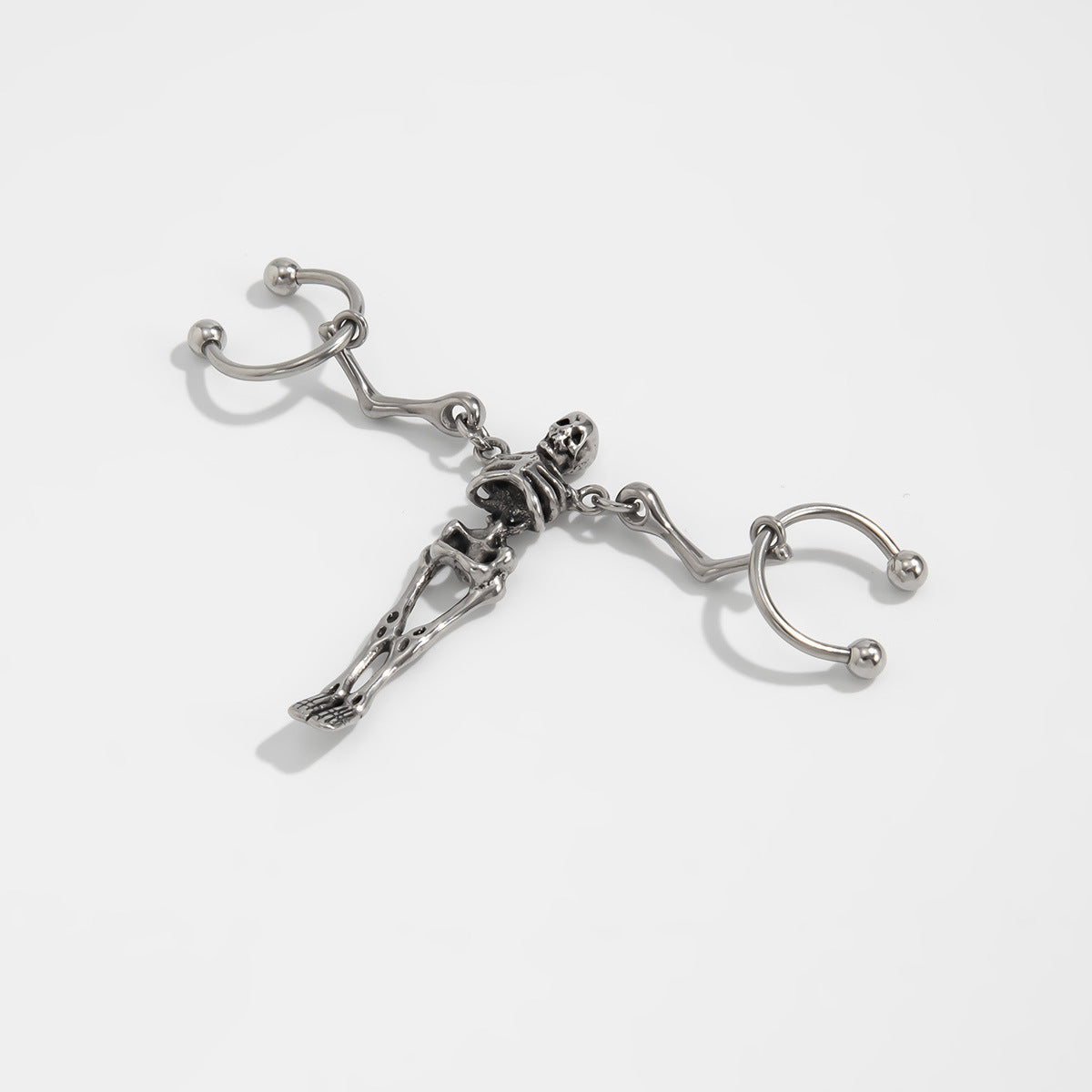 Wholesale Sweet and cool titanium steel skull ear bone earrings