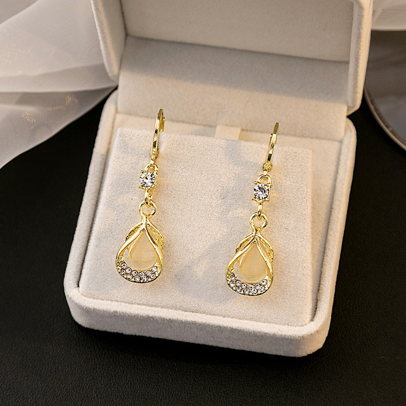 Wholesale Cat's Eye Stone Diamond Droplet Hollow Alloy Earrings