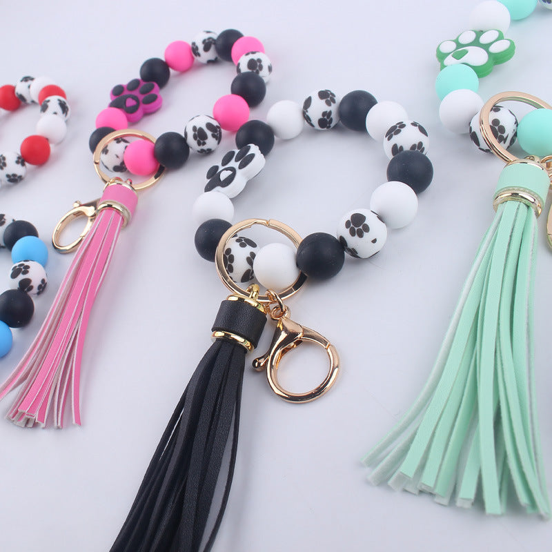 Wholesale Chic Silicone Bead Dog Paw Bracelet Keychain With Leather Tassel Fashion Gift For Resale