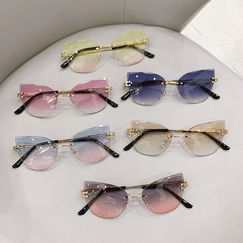 Wholesale Retro frameless cut-edge sunglasses cat-eye gradient sunglasses
