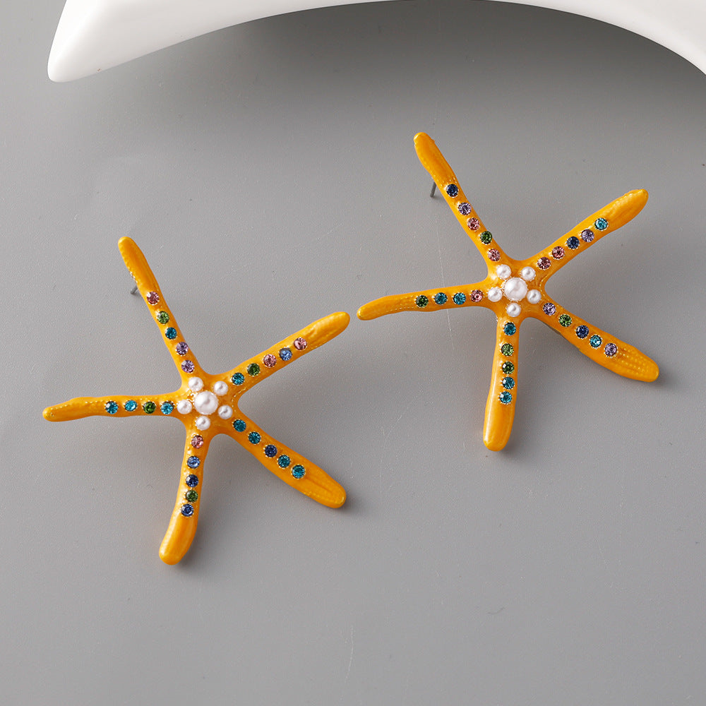 Pendientes al por mayor de aleación de perlas de estrellas de mar