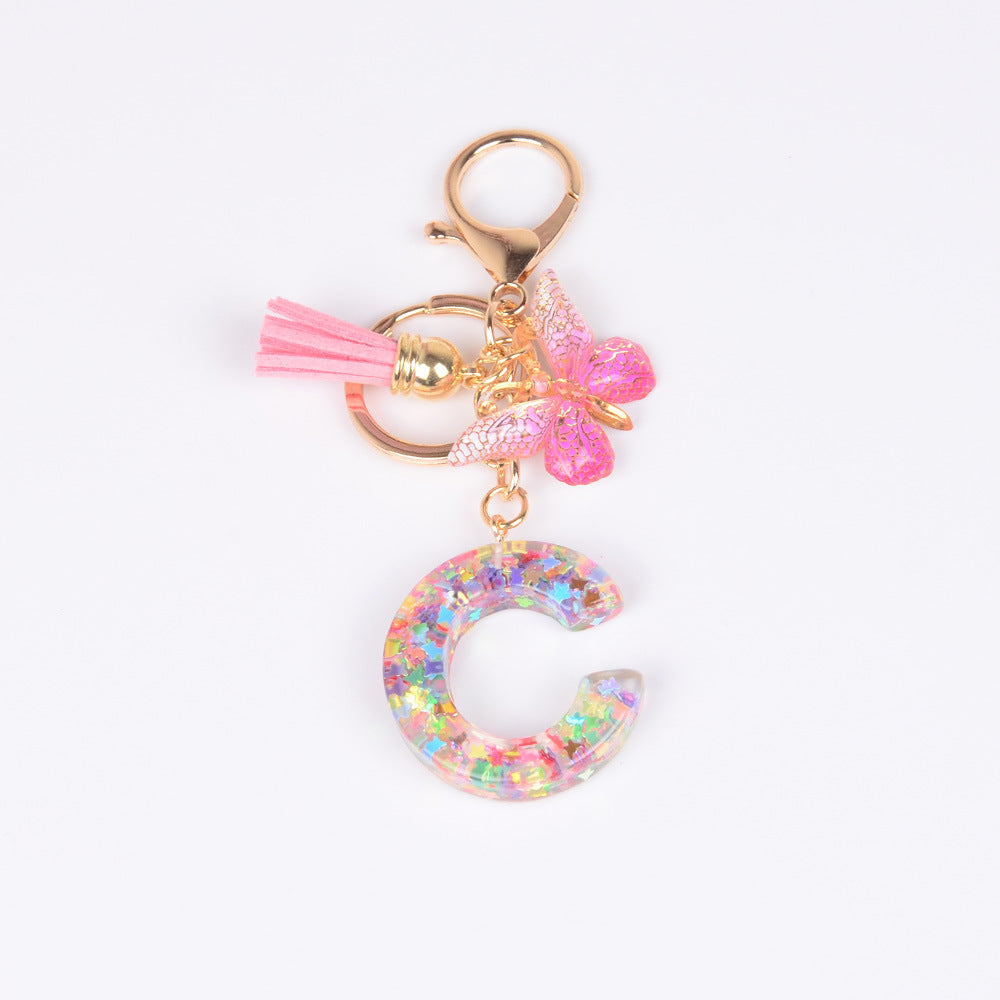 卸売スパンコール英語蝶タッセル文字樹脂キーホルダー