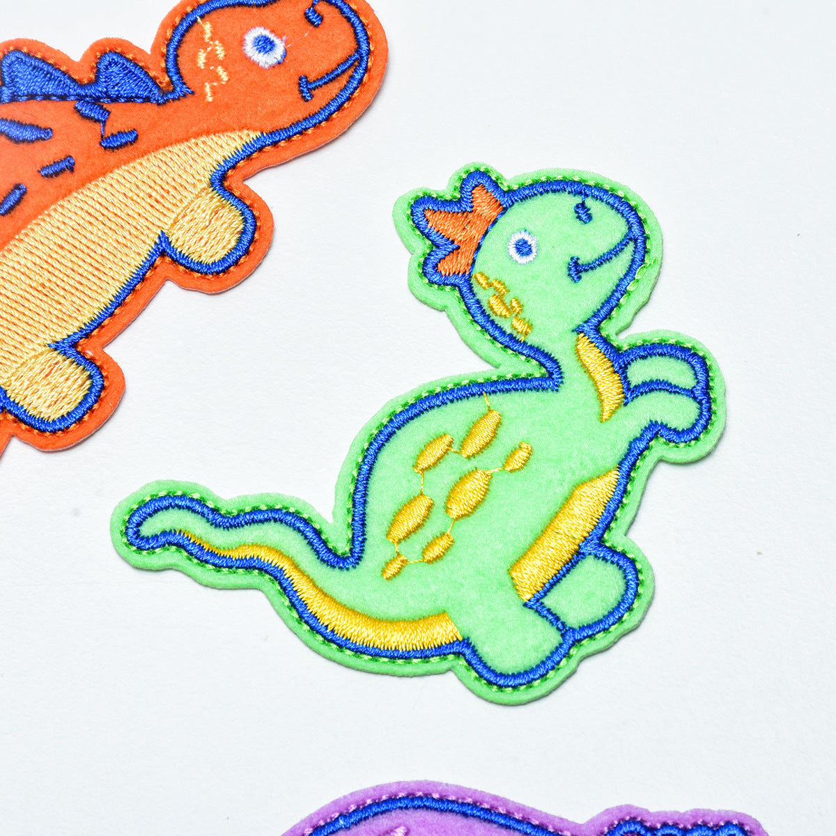 Wholesale Trendy Embroidered Fabric Patches 12 Pack Dinosaur Cartoon Animal Sew On Clothing Decorative DIY Patches For Resale