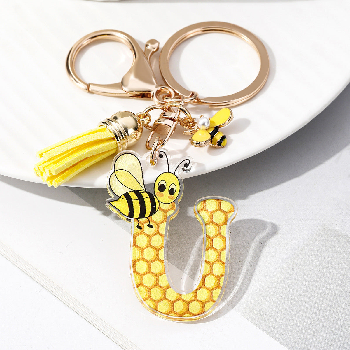 Wholesale Bee Honeycomb Acrylic English Letter Tassel Bee Enamel Keychain