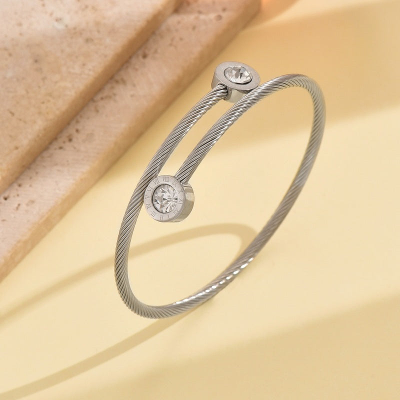 Wholesale Stainless steel artificial zircon silver open bangle with a twisted design
