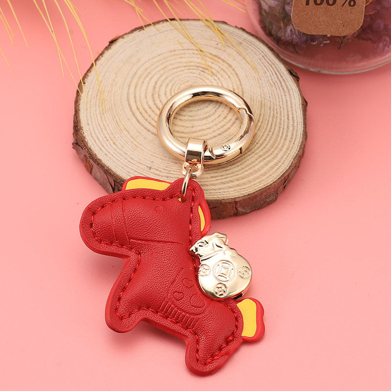 Wholesale Immediately get rich handmade cow leather car keychain pendant