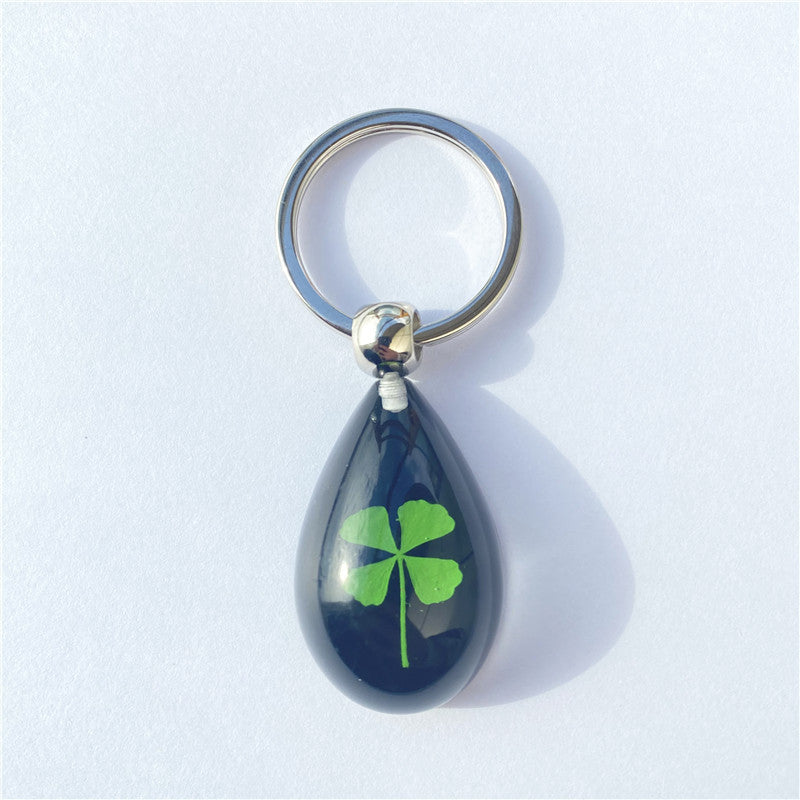 Wholesale 12pcs Four-leaf Clover Luminous Keychain