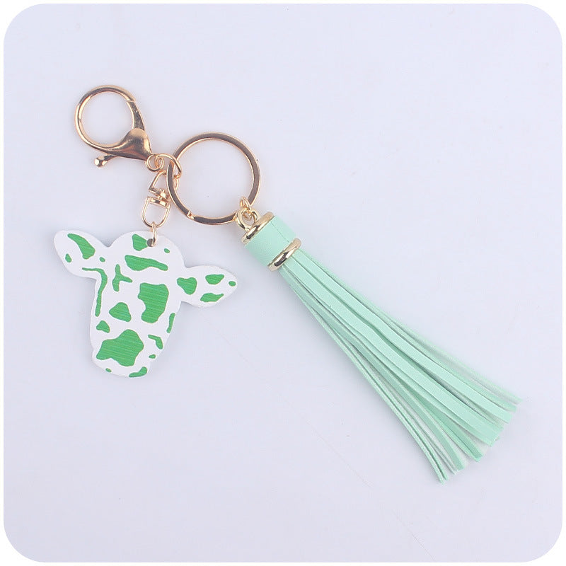 Caricatura al por mayor de toro occidental cabeza de madera colorida llavero largo de borla larga
