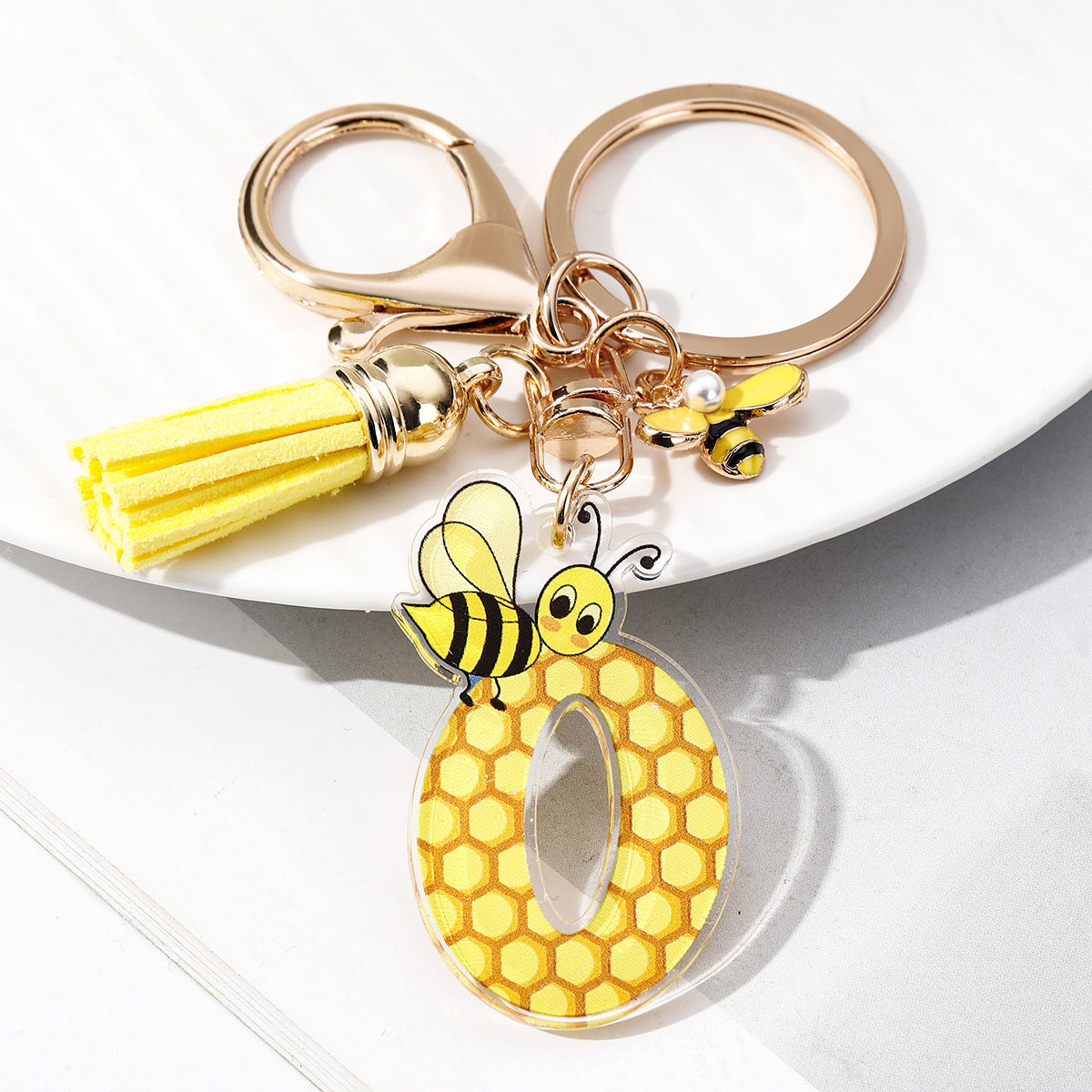 Wholesale Bee Honeycomb Acrylic English Letter Tassel Bee Enamel Keychain