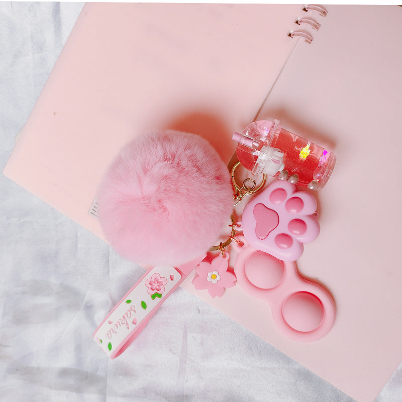 Silicona de silicona al por mayor Liquid Glow Cat Claw Fur Ball Keychain