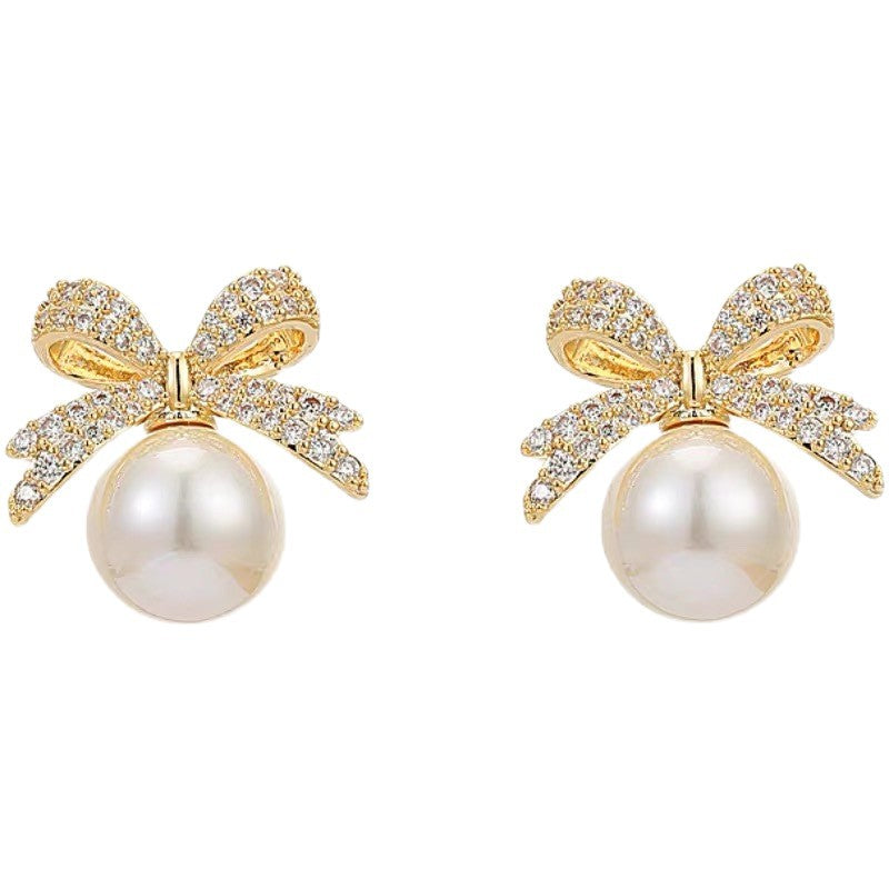 Wholesale Bow set with diamond studded pearl earrings