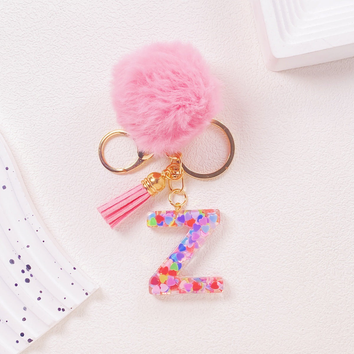 Wholesale Hairball English 26 letter pink Pom Pom keychain