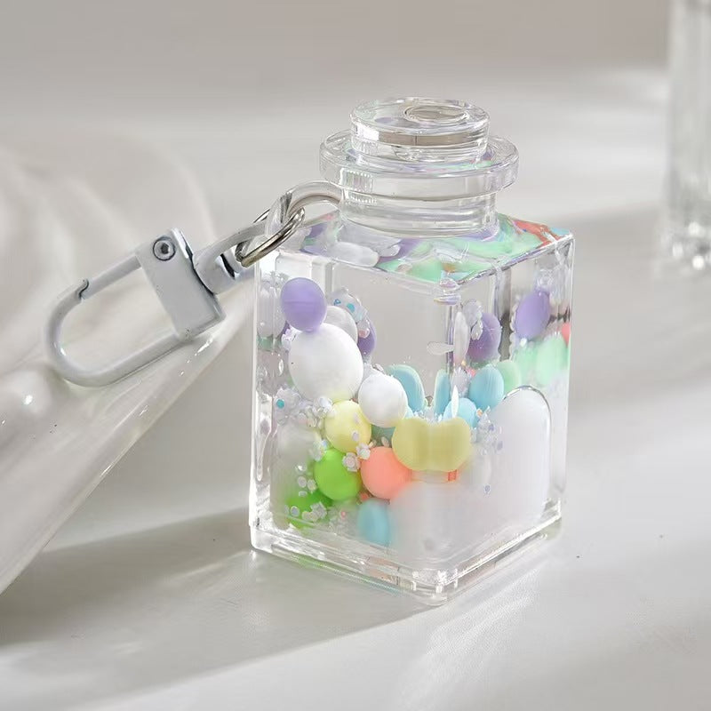 Wholesale Liquid sand bottle with colorful beads in oil bottle pendant acrylic keychain