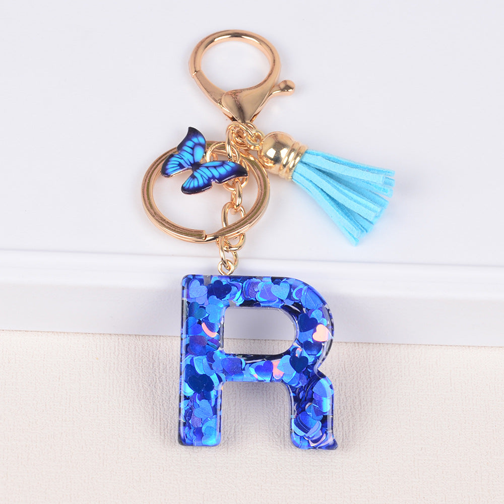 卸売ブルーラブバタフライタッセルレター樹脂キーホルダー