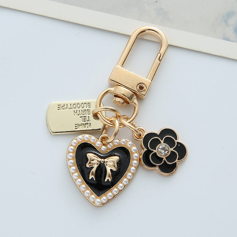 Wholesale Bowknot Pearl Alphabet Heart Hair Ball Alloy Keychains