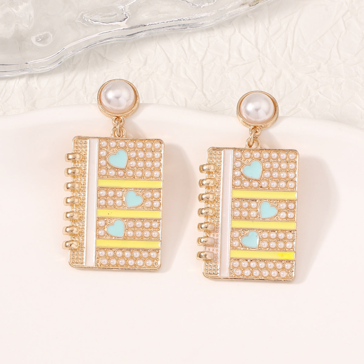 Wholesale of Diamond Alloy Earrings for Starting School Season Books